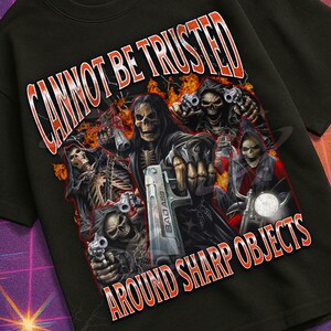 May include: Black t-shirt with a graphic of skeletal figures holding weapons, and the text "CANNOT BE TRUSTED AROUND SHARP OBJECTS." The shirt also has the text "MILDLY PERTURBED" at the bottom.