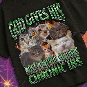 May include: Black t-shirt with a graphic of several cats and the text "GOD GIVES HIS MOST POWERFUL SOLDIERS CHRONIC IBS." The shirt also features the text "MILDLY PERTURBED" in a retro font.