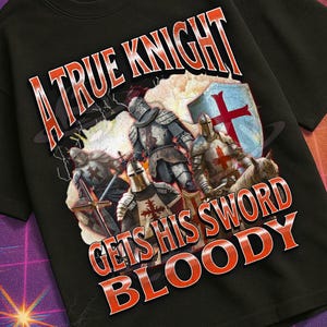 May include: Black t-shirt with a graphic of knights in armour and the text "A True Knight Gets His Sword Bloody" in red and white. The shirt is part of the Mildly Perturbed collection.