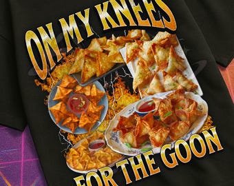 May include: Black t-shirt with a graphic featuring plates of food and the text "ON MY KNEES FOR THE GOON." The shirt also has the text "MILDLY PERTURBED" and a retro design.