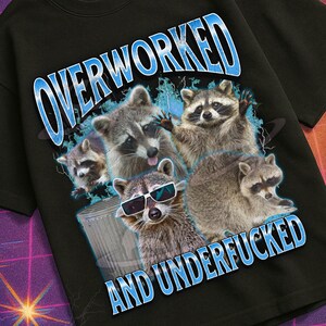 May include: Black t-shirt featuring a graphic of raccoons and the text "OVERWORKED AND UNDERFUCKED". The shirt also has the text "MILDLY PERTURBED" in a retro style.