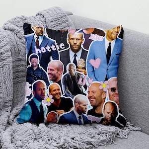 May include: Square decorative pillow featuring a collage of images of a man in various poses. The images are surrounded by pink hearts, flowers, and the words "hottie", "pretty", "xoxo", and "ily". The pillow is on a gray couch.