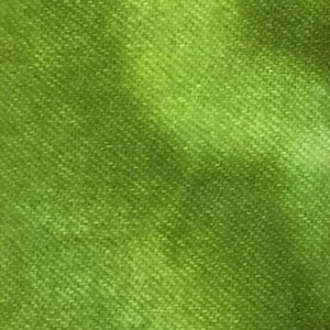May include: A close-up of a green fabric with a textured surface.