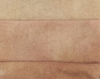 May include: Three fabric swatches in different shades of brown. The top swatch is a light beige, the middle swatch is a medium brown, and the bottom swatch is a dark brown.