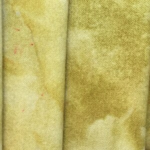 May include: Four fabric swatches in shades of yellow and green. The swatches are arranged vertically, with the lightest shade on the left and the darkest shade on the right.