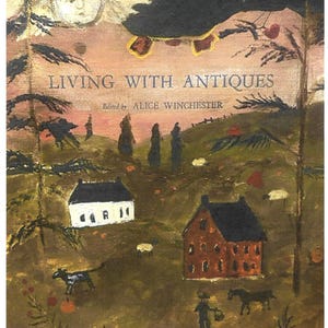 May include: An antique-style painting titled "Living with Antiques" edited by Alice Winchester. The artwork depicts a rural scene with houses, figures, animals, and pumpkins in a warm color palette. An angel-like figure is at the top.