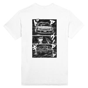 May include: White t-shirt featuring a black and white manga-style graphic. The graphic depicts a car in motion, with Japanese text and a driver. The design is split into three panels, showcasing the car from different angles.