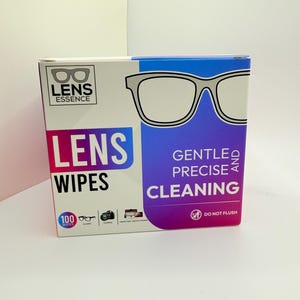 May include: A box of Lens Essence lens wipes. The box is white with a blue and purple gradient. The text "LENS WIPES" is in large, colorful letters. The box also features a glasses graphic and the words "GENTLE AND PRECISE CLEANING."
