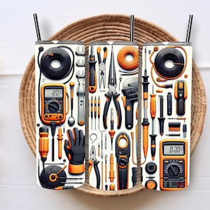 May include: Three white insulated tumblers with a repeating pattern of electrical tools, including multimeters, pliers, screwdrivers, and wire. The tools are in black, orange, and gray. The tumblers have black straws and are set in a woven basket.