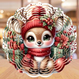 May include: A festive Christmas ornament featuring a cute cartoon deer wearing a red hat and scarf. The deer is surrounded by gifts, holly, and ornaments. The ornament has a scalloped edge and is set against a blurred background.