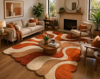 May include: A large area rug featuring a wavy, organic pattern in shades of burnt orange, cream, and tan. The rug has a thick, plush texture with rounded, scalloped edges that follow the fluid, curved lines of the multi-colored design.