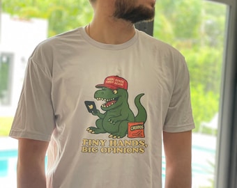 Camiseta con gráfico de dinosaurio - "Manos pequeñas, grandes opiniones" - Camiseta unisex divertida y relajada