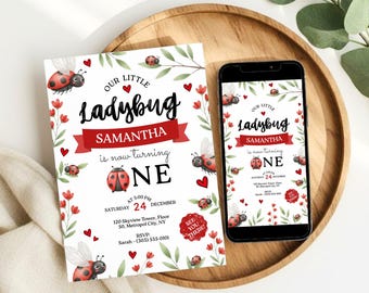 May include: A printed invitation and a smartphone displaying a digital invitation for a first birthday party. The design features ladybugs, red hearts, and green foliage on a white background with the text Our Little Ladybug Samantha is now turning ONE.