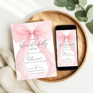 May include: A pink and white first birthday invitation with a large bow design. The invitation includes the text "Fearfully and Wonderfully Made" and "Olivia's First Birthday". A smartphone displays the same invitation.