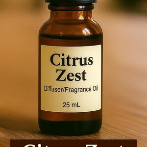 May include: A brown glass bottle with a black cap, labeled "Citrus Zest Diffuser/Fragrance Oil, 25 mL." The bottle sits on a wooden surface. The words "Citrus Zest" are also displayed in a brown banner at the bottom.