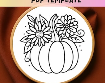 May include: A black and white line art design of a pumpkin with two flowers and leaves, set in a wooden embroidery hoop. The text "PDF TEMPLATE" is at the top. The design is on a white background.