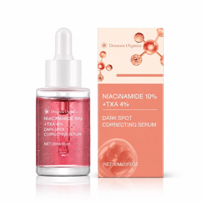 May include: A clear glass bottle with a white dropper and a pink serum, next to a peach-colored box. The bottle and box both display the text "NIACINAMIDE 10% +TXA 4% DARK SPOT CORRECTING SERUM". The bottle contains 1 fl oz of serum.