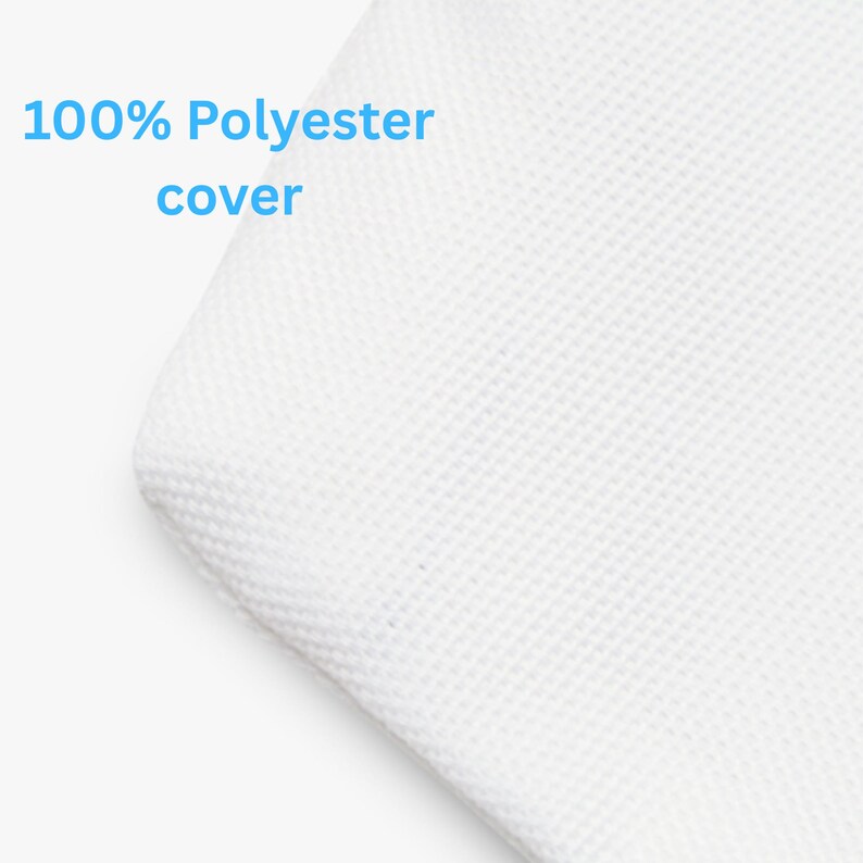 May include: Close-up of a white, textured fabric corner. The text "100% Polyester cover" is displayed in light blue, indicating the material composition of the item.