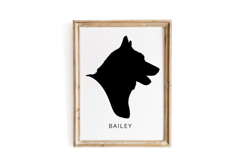 May include: A framed black and white silhouette of a dog's head, with the name "BAILEY" printed below the image.