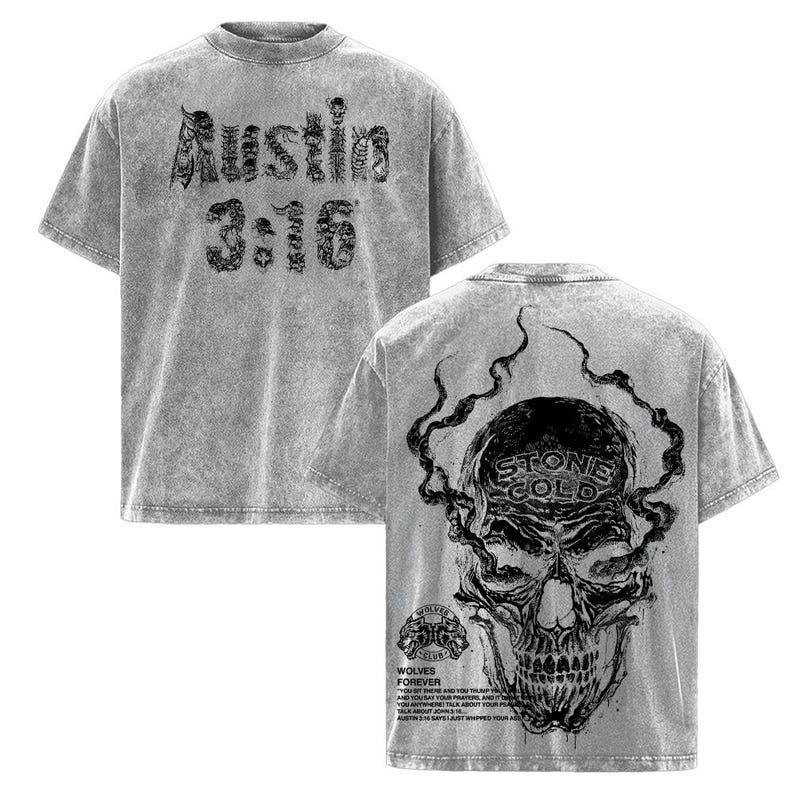 May include: Grey acid wash t-shirt with black graphic text and skull design. The front of the shirt features the text "Austin 3:16". The back of the shirt has a skull with the words "Stone Cold" and additional text.