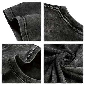 May include: Close-up shots of a dark gray, acid-washed t-shirt. The images highlight the texture and stitching details of the fabric, including the neckline, sleeves, and hem. The fabric appears soft and slightly worn.