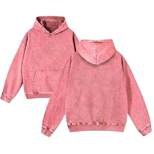 May include: Two pink hoodies are displayed, showing the front and back. The hoodies have a distressed, vintage wash effect, a kangaroo pocket, and a drawstring hood. The cuffs and hem are ribbed.