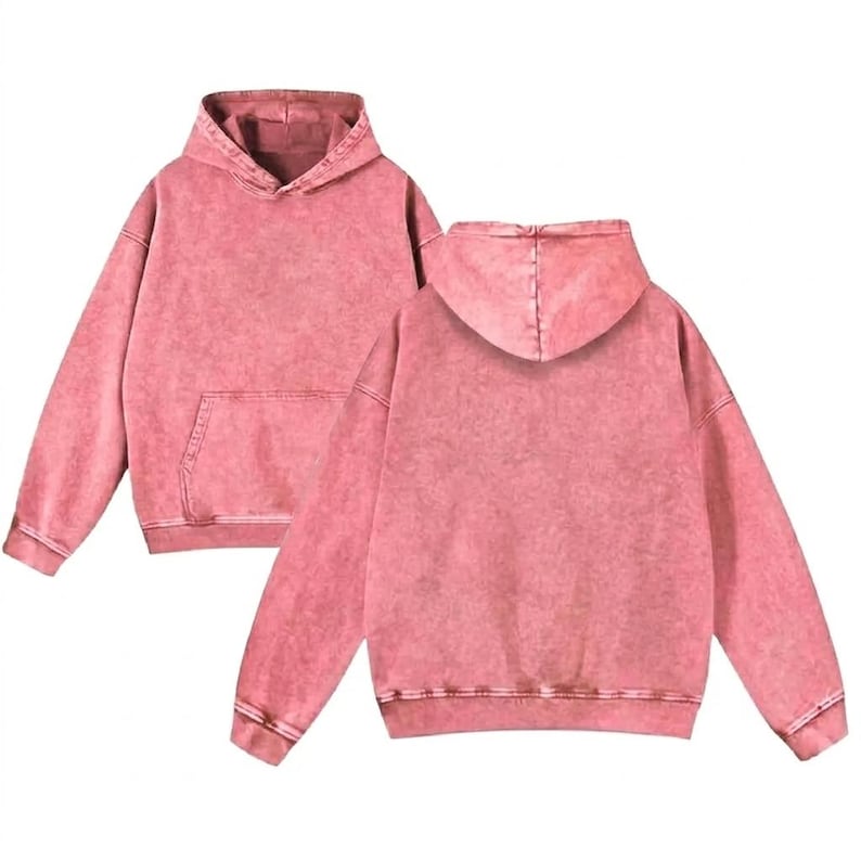 May include: Two pink hoodies are displayed, showing the front and back. The hoodies have a distressed, vintage wash effect, a kangaroo pocket, and a drawstring hood. The cuffs and hem are ribbed.