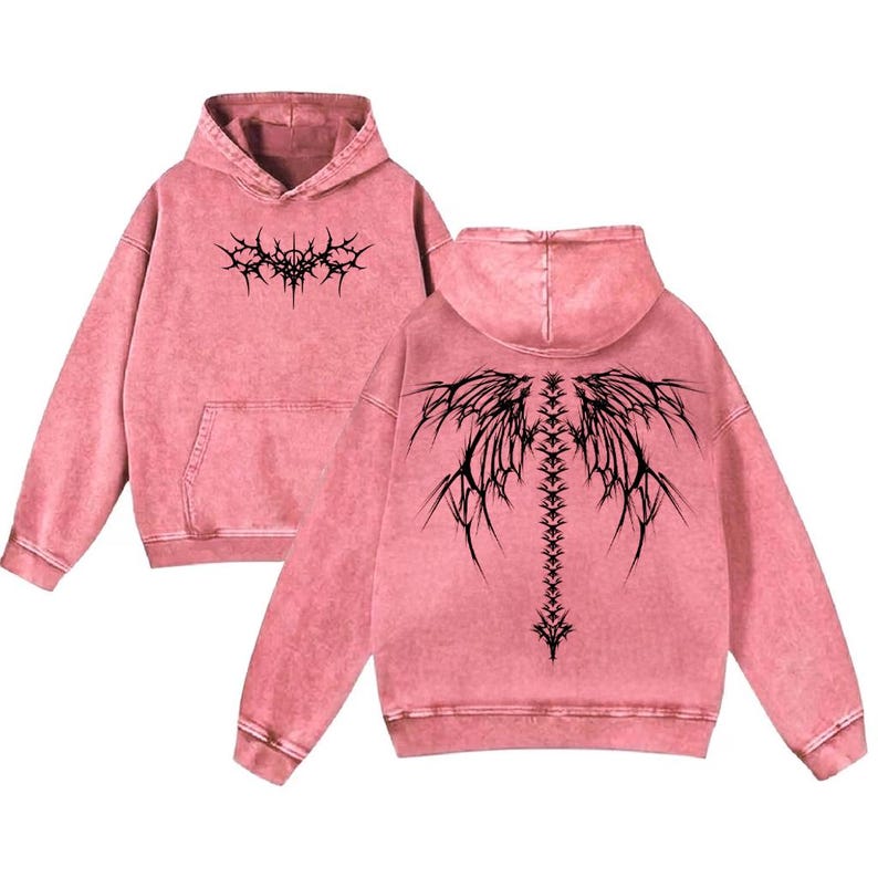 May include: Pink hooded sweatshirt with a front pocket and a black graphic design on the front and back. The back design resembles a spine with wing-like extensions. The sweatshirt has a washed, vintage look.