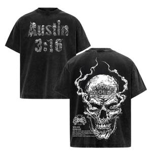 May include: Black t-shirt with white graphic text and skull design. The front features "Austin 3:16" in a skeleton-style font. The back displays a detailed skull with "Stone Cold" and "Wolves Forever" text.