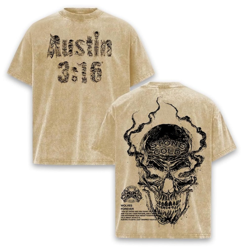 May include: A tan t-shirt with black graphic text and a skull design. The front of the shirt says "Austin 3:16". The back of the shirt features a skull with the words "Stone Cold" and "Wolves Forever".