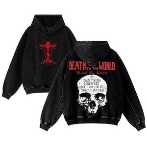 May include: Two black hooded sweatshirts with graphic designs. One features a red cross design, and the other displays a skull with the text "DEATH TO THE WORLD" and "WHAT YOU ARE ONCE WAS WHAT I AM YOU WILL SURELY BECOME."