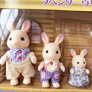 May include: A set of three ceramic mugs with a speckled, matte finish. The mugs are in shades of cream, light gray, and dark gray. Each mug has a simple, minimalist design, perfect for coffee or tea.