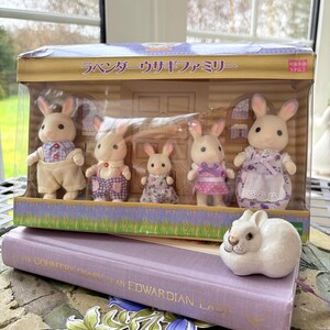 May include: A rustic wooden sign with the text "Welcome to our home" in white lettering. The sign features a distressed finish and a simple, inviting design, perfect for entryway decor.