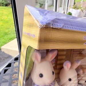 May include: A set of three ceramic mugs with a speckled, matte finish. Each mug features a different color: light blue, cream, and gray. The mugs have a simple, modern design with a rounded shape and a comfortable handle.