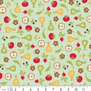 May include: A green fabric with a repeating pattern of pears, apples, tomatoes, radishes, flowers, and leaves.