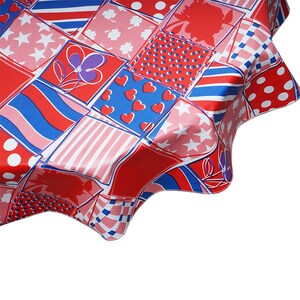 May include: A round tablecloth featuring a patchwork design of red, white, and blue squares. The pattern includes various motifs such as white stars on pink, red hearts on blue, white polka dots on red, striped sections, and purple floral outlines.