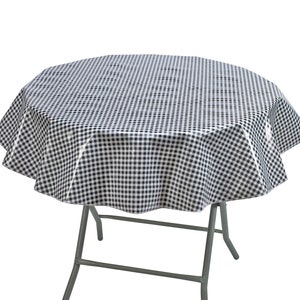 May include: A round black and white checkered tablecloth draped over a folding table. The tablecloth has a classic gingham pattern. The table has a gray metal frame and legs. The tablecloth is made of a shiny material.