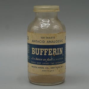 May include: A vintage glass bottle of Bufferin antacid analgesic tablets. The label is cream and blue with the text "100 Tablets" and "Acts twice as fast as aspirin". The bottle is filled with a light brown powder and has a white cap.