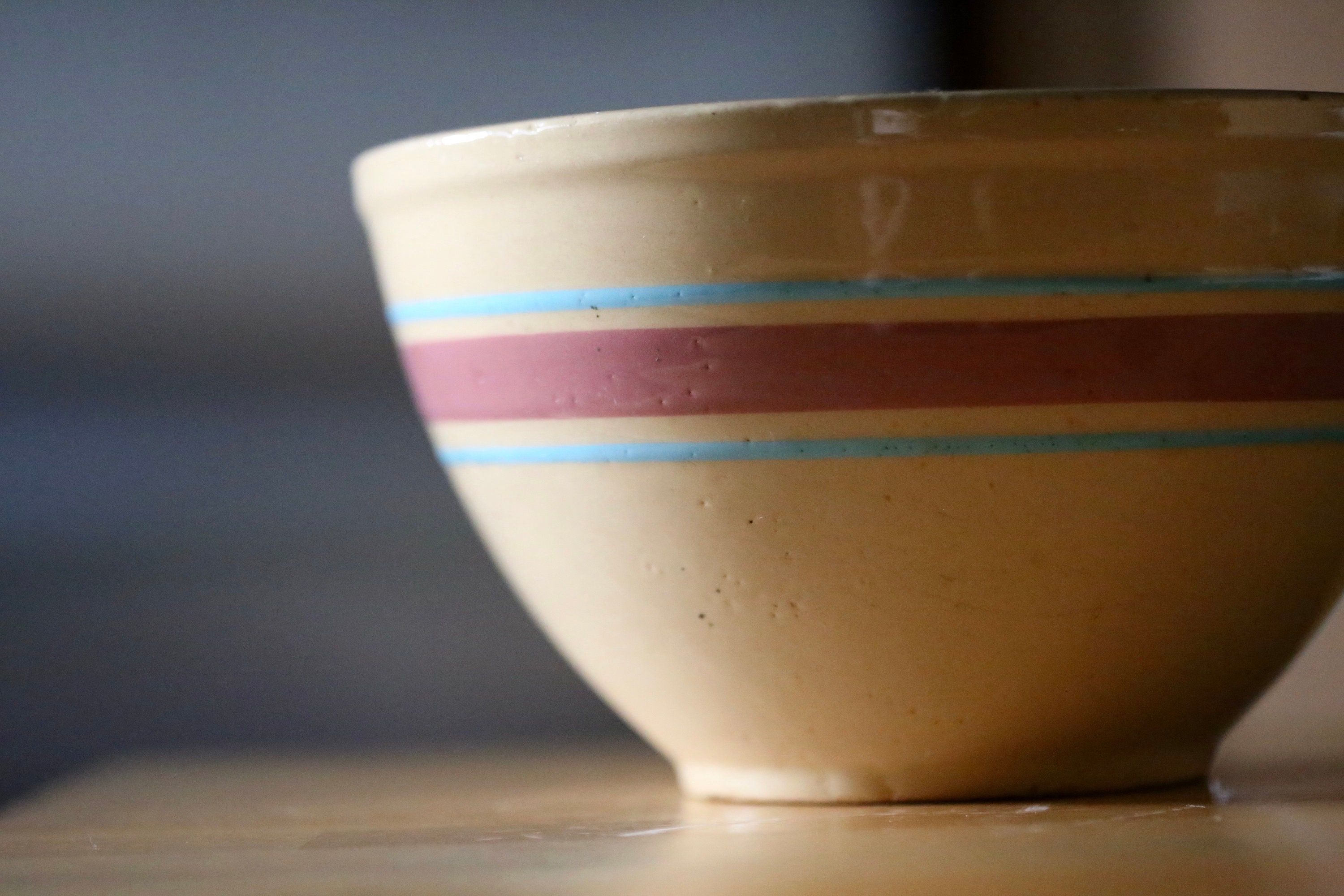Vintage Watt Pottery Mixing Bowl: Yellow Ware with Pink & Blue Stripes