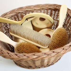 Bakelite grooming accessories in a basket at Kate&#39;s Vintage Market