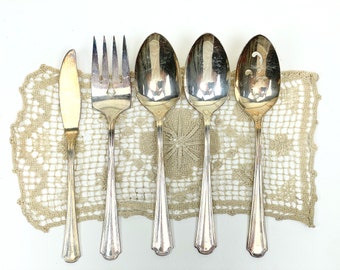 Antique set of silver plated serving spoons, a fork,  butter knife and slotted serving spoon