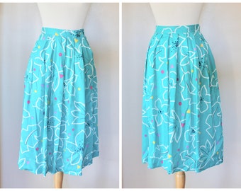 Vintage 1980s Bright Teal Blue Rayon Pleated Abstract Floral Skirt with White, Pink, and Yellow Floral Design - Size 8 / Fun