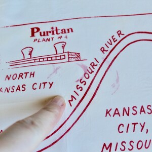 May include: A red and white hand-drawn map of Kansas City, Missouri. The map shows the location of the Puritan Plant #4, the Missouri River, and the text "North Kansas City".