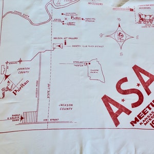 May include: A red and white map of Kansas City, Missouri, with a red star and the text "ASA Meeting Kansas City, Missouri 1956". The map shows the location of the Puritan Hotel, the Starlight Theater, and Swope Park.