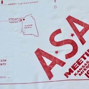 May include: A red and white map with the text "ASA Meeting Kansas City, Missouri 1956". The map shows the location of Starlight Theater and Swope Park in Kansas City, Missouri.