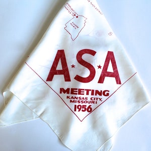 May include: White cotton bandana with red lettering that reads "A*S*A MEETING KANSAS CITY, MISSOURI 1956".