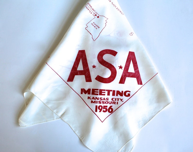 May include: White cotton bandana with red lettering that reads "A*S*A MEETING KANSAS CITY, MISSOURI 1956".