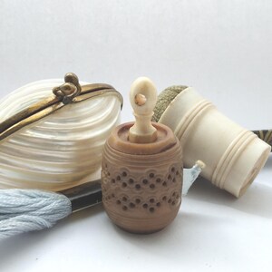 Antique tagua nut tape measure with pierced lacy pattern, decorative, stanhope missing