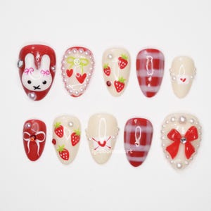 Strawberry Bunny Press On Nails, Red Cream Cute Nail Art, Heart Bow Pearl Nails, Kawaii Checkered Nail Design, 3D Character Nail Tips OB108