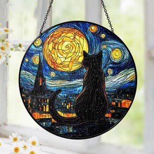 May include: Round stained glass panel featuring a black cat silhouetted against a starry night sky and a large yellow moon. The artwork is reminiscent of Van Gogh's style, with swirling blues, yellows, and oranges. A decorative piece with a chain for hanging.